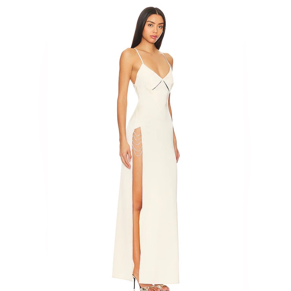 sleeveless gown with a strappy open back and embellished side slit
